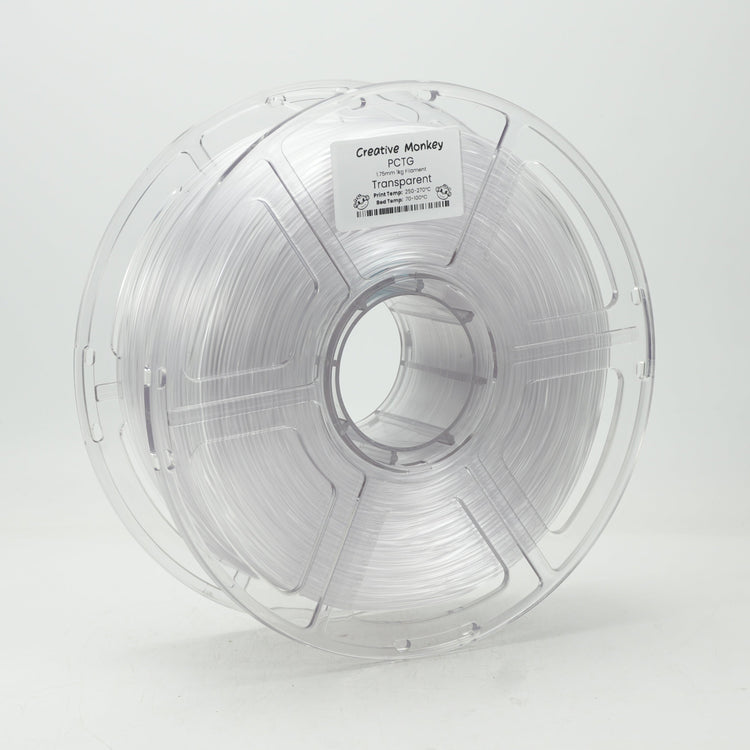 A spool of clear filament wound on a clear plastic core, photographed against a seamless light gray studio background. A small label on the top reads 'Clearfil Moly' and 'SP-70'.